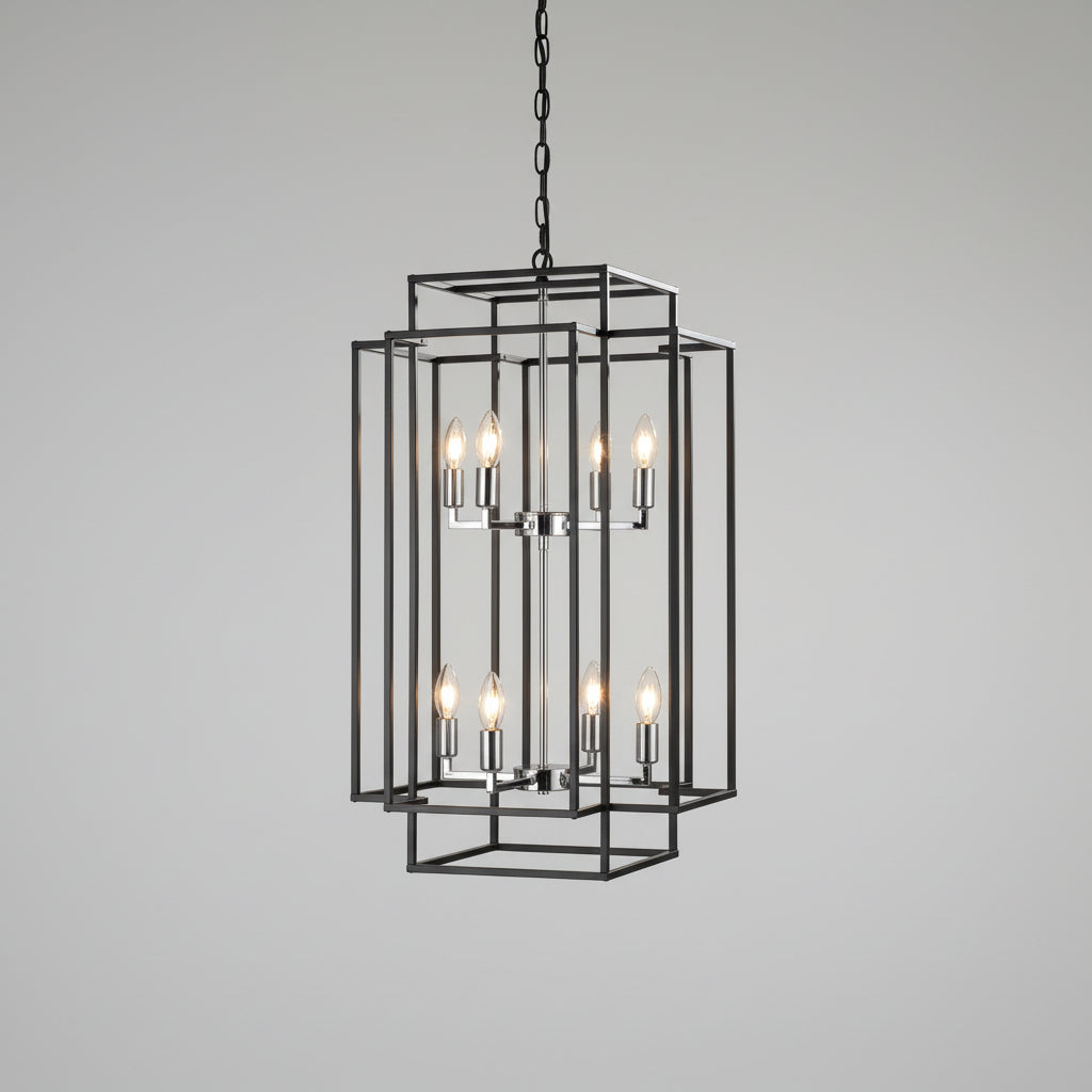 Modern black chandelier hanging in a room with beige walls and a window.