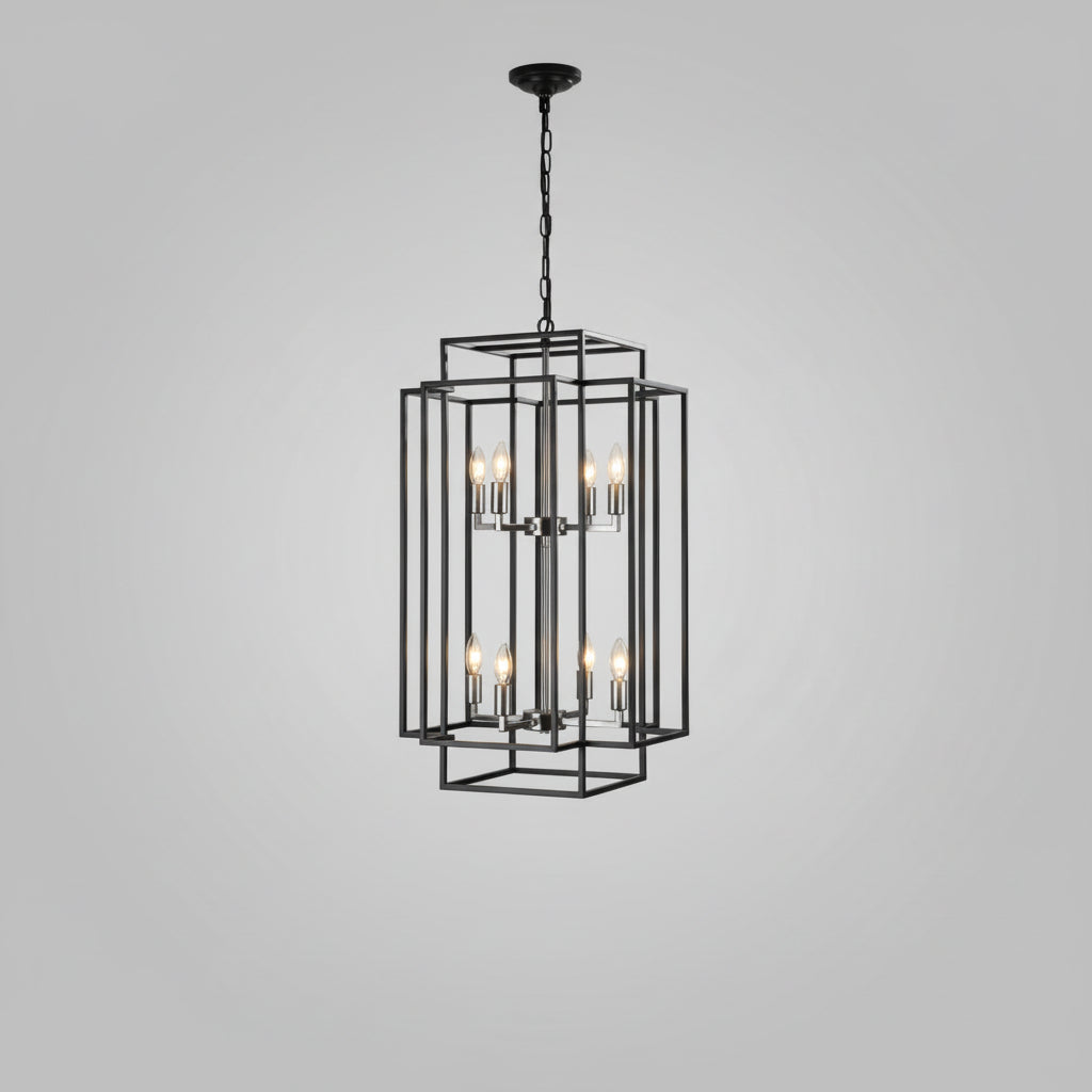 Modern chandelier hanging in a stylish interior with staircase and window.