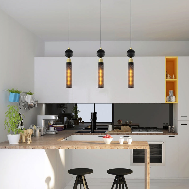 Modern kitchen with pendant lights, island, and white cabinets