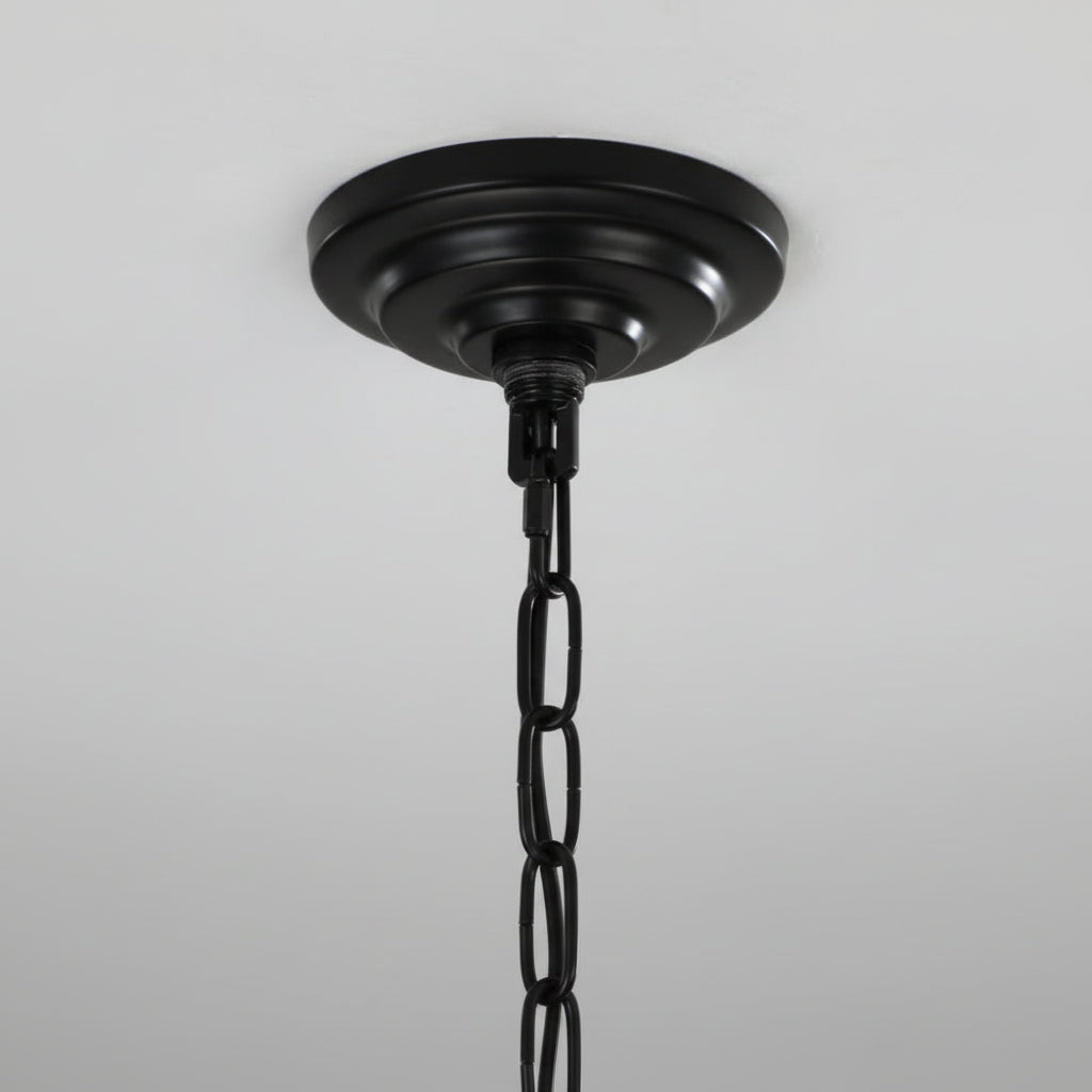 Black ceiling light fixture on a gray background